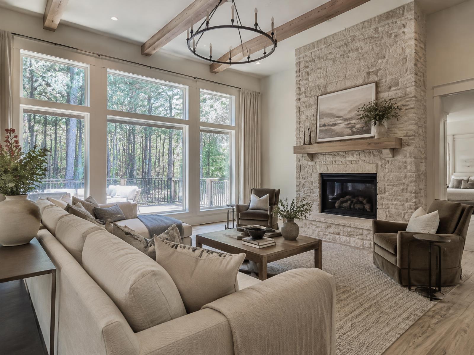 Bright family room with stone fireplace and with wooded views (illustrative image)